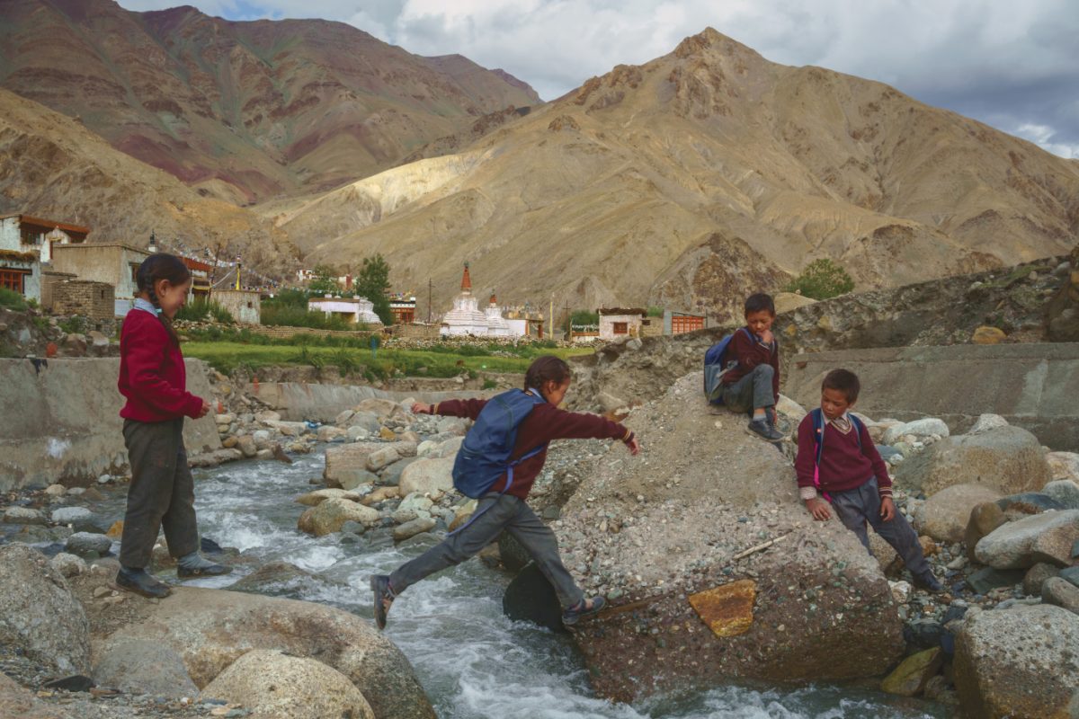 the school boys are playing and jumping across Sindhu river, India
