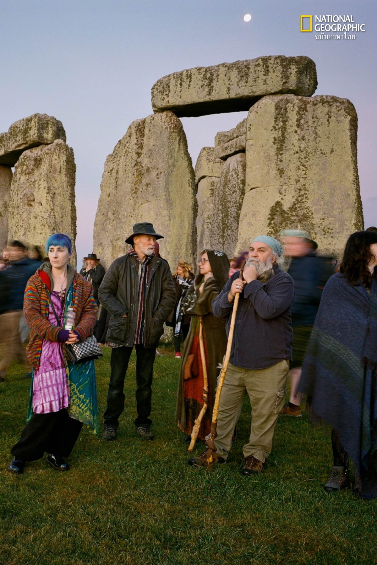 visitors gather at Stonehenge for the autumn equinox amid a full moon